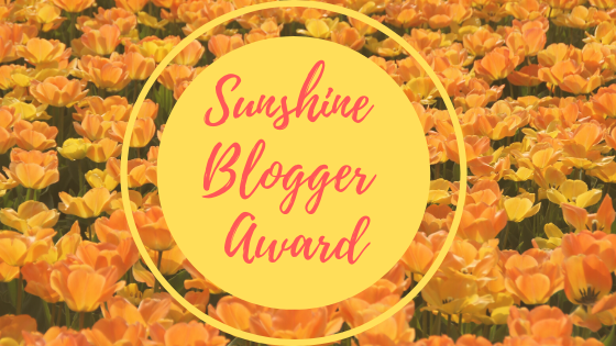 Sunshine blogger award photo of sunshine on flowers in a field